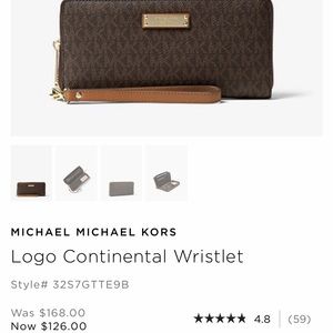 Lightly used Michael Kors wristlet wil fit IPhone8